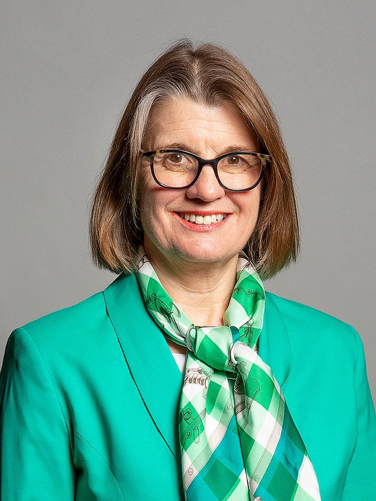 Housing Minister Rachel Maclean portrait in green blazer and scarf