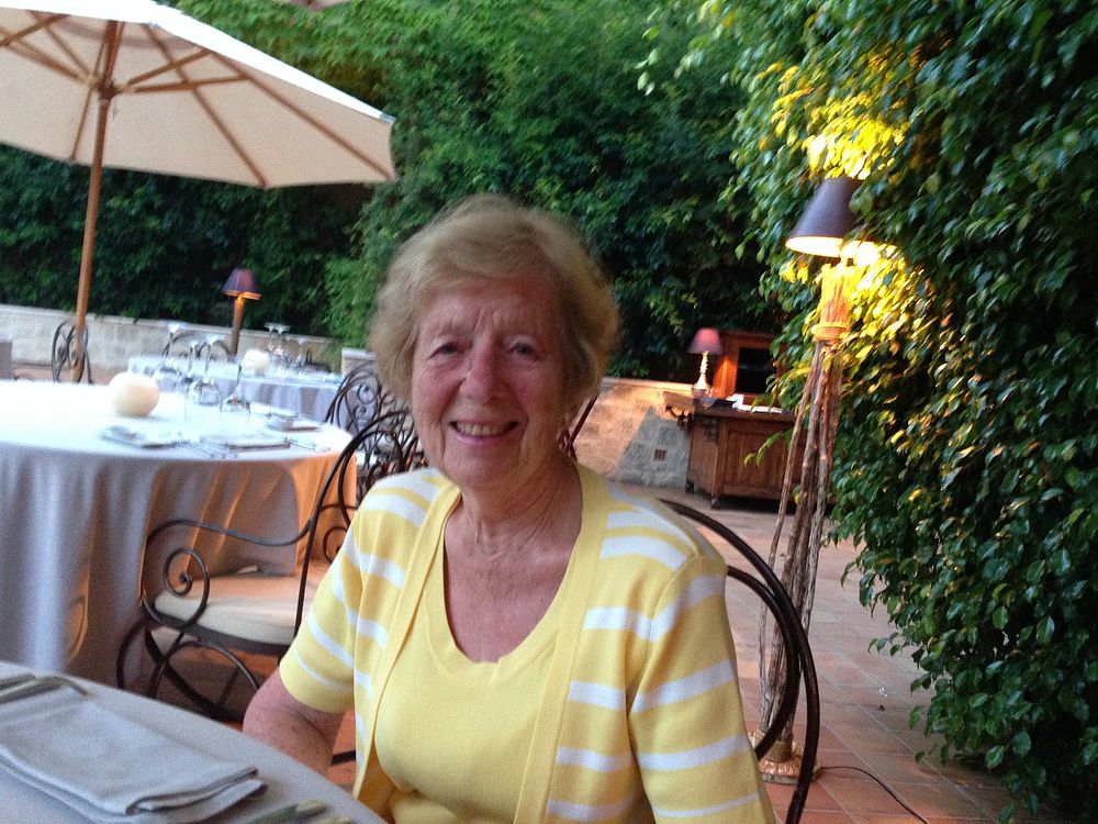 Lilian Drysdale sitting at an outdoor restaurant table